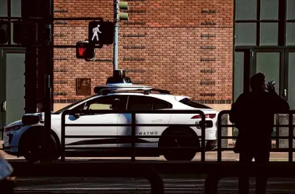  ?? Carlos Avila Gonzalez/The Chronicle 2023 ?? A Waymo autonomous vehicle drives down King Street in San Francisco last year. State regulators have approved the company’s expansion beyond the city, but experts said rollout is likely to be slow.