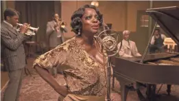  ?? DAVID LEE/NETFLIX ?? From left, Levee (Boseman), Cutler (Domingo), Ma Rainey (Viola Davis), Toledo (Glynn Turman) and Sylvester (Dusan Brown).