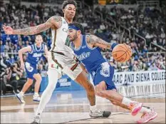  ?? Jim Franco / Times Union ?? Drake’s Roman Penn, who played for Siena as a freshman, said he was thankful for a chance to play in the NCAA event.
