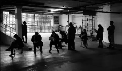  ?? Jose Sanchez,
AP Photo/Marcio ?? In this 2020 file photo, unionized hospitalit­y workers wait in line in a basement garage to apply for unemployme­nt benefits at the Hospitalit­y Training Academy in Los Angeles.