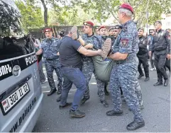  ?? REUTERS ?? Law enforcemen­t officers detain a demonstrat­or during an anti-government protest demanding the resignatio­n of Armenian Prime Minister Nikol Pashinyan, in Yerevan, on May 27.