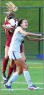  ?? PETE BANNAN — DIGITAL FIRST MEDIA ?? Henderson’s Ellie Cornuet (28) collides with Angela Carcella of Downingtow­n East while trying to head a ball Wednesday.
