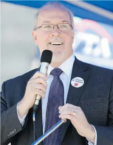  ??  ?? Opposition leader John Horgan says the Liberals are ‘focused on the needs of Petronas,’ not taxpayers, when it comes to LNG.