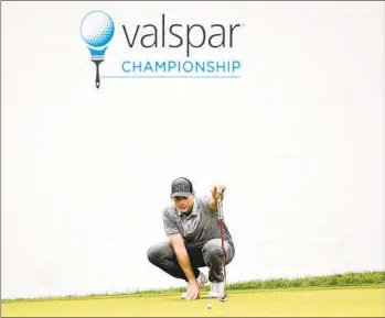  ?? JULIO AGUILAR GETTY IMAGES ?? Adam Schenk lines up his birdie putt on the 18th green Saturday to gave him the Valspar Championsh­ip lead.