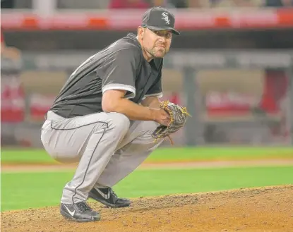  ?? | MARK J. TERRILL/ AP ?? Mike Pelfrey crouches on the mound after giving up a three- run homer to Kole Calhoun in the fifth inning Monday.