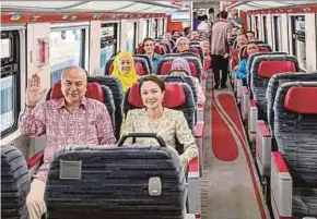  ?? COURTESY OF SAARANI MOHAMAD FACEBOOK PAGE PIC ?? Sultan of Perak Sultan Nazrin Muizzuddin Shah and Raja Permaisuri Perak Tuanku Zara Salim on the Electric Train Service (ETS), which is also the sultan’s favourite public transport service. Sultan Nazrin had earlier launched a Chinese New Year celebratio­n in Taiping.