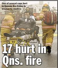  ??  ?? One of several cops hurt in Queens fire Friday is treated by medics.