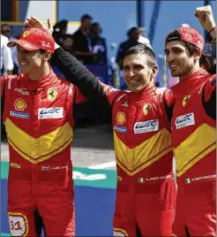  ?? JEREMIAS GONZALES/ASSOCIATED PRESS ?? Ferrari AF Corse drivers Antonio Giovinazzi (right) Alessandro Pier Guidi (center) from Italy and James Calado from Britain celebrate their victory at the 100th 24-hour Le Mans endurance race Sunday in Le Mans, France.