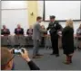  ?? DAN SOKIL — DIGITAL FIRST MEDIA ?? New Lansdale Police Chief Michael Trail shakes hands with Mayor Garry Herbert as council members applaud after Trail was sworn in Wednesday.
