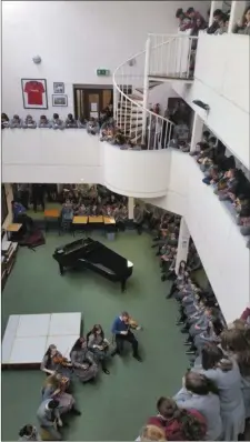  ??  ?? Students enjoying the weekly music recital in the school.