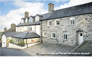  ??  ?? > Castle Cottage on Ffordd Pen Llech in Harlech