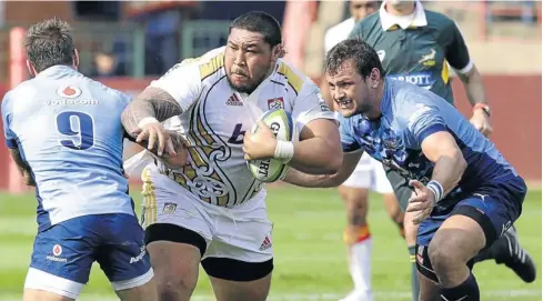  ?? Picture: RAYMOND PRESTON ?? MOVE ASIDE: Giant Chiefs prop Ben Tameifuna scythes through the Bulls defence, leaving Francois Hougaard, left, and Bulls hooker Callie Visagie with the un enviable task of trying to bring the big man down