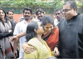  ?? PTI ?? DMK MP Kanimozhi celebrates with her husband G Aravindan and mother Rajathi Ammal (left) after she was acquitted by a special court in the 2G spectrum case in New Delhi on Thursday.