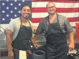  ??  ?? Co-owners Al Iniguez, left, and Jeff Palladino, right, stand inside Chef Jeff’s Hot Meals to Go restaurant at 718 MacDade Blvd., Ridley Township.