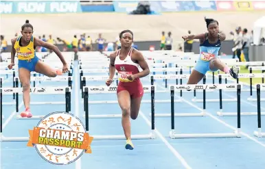  ??  ?? Shanette Allison is well clear of the field as she takes heat two of the girls’ class two sprint hurdles in a Champs record 13.30 secs.