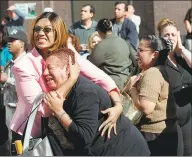  ?? Ernesto Mora / AP file photo ?? Two women hold each other as they watch World Trade Center buildings burn after a terrorist attack on the twin towers in New York on Sept. 11, 2001.