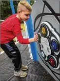  ?? PHIL SKINNER FOR THE AJC ?? Bryce Davis, 10, plays a memory game at the all-inclusive playground at Alpharetta Elementary School.