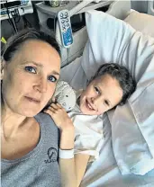  ??  ?? Hospital ‘bubble’: Jess Spiring and her daughter Tilda, who is recovering from surgery, but cut off from their loved ones