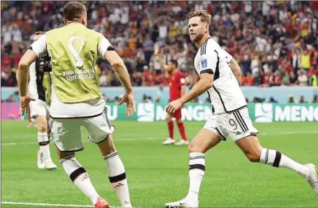  ?? ?? Niclas Fullkrug runs off after his late goal for Germany against Spain yesterday evening