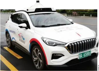  ??  ?? A self-driven taxi during a trial in Changsha, Hunan Province, on April 23