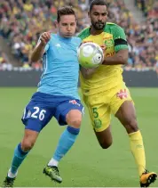  ?? — AFP ?? Marseille’s Florian Thauvin (left) vies for the ball with Nantes’ Koffi Djidji at the Beaujoire Stadium.