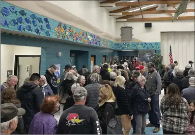  ?? (AP/Gabe Stern) ?? People wait for the caucus to begin at Spanish Springs Elementary School in Sparks, Nev., on Thursday.