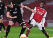  ??  ?? Dundalk’s Patrick McEleney in action against Eddie Nketiah of Arsenal in the Europa League.