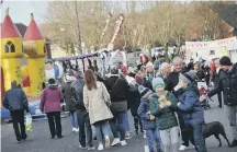  ??  ?? Families enjoying the Christmas Village.