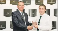  ??  ?? CONGRATULA­TIONS: Steven Bracken of Marine Harvest presents Oban Celtic’s Daniel Madej with the South Division One player of the Year award. As Lochside Rovers manager Gareth Evans was unable to be at the ceremony, Daniel also picked up his Manager
of...