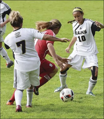  ?? Cody MCEaCHErn/Truro daILy nEws ?? Leah Wiseman (10) and teammate Shanice Maxwell (7) pressure a UNBSJ Seawolves player during ACAA women’s soccer action Saturday. The Rams and Seawolves settled on a 1-1 draw.
