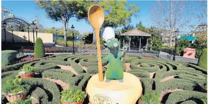 ?? JOE BURBANK/ORLANDO SENTINEL ?? Disney’s Remy greets guests in the France pavilion as one of the new topiaries on display last month previewing the 2020 Epcot Internatio­nal Flower & Garden Festival at Walt Disney World, in Lake Buena Vista, Fla. The festival runs from March 4 to June 1.