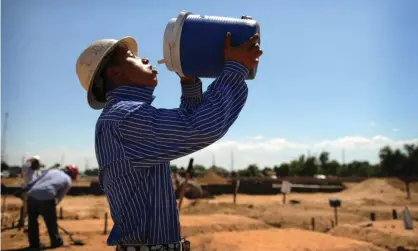  ?? Cyrus McCrimmon/Denver Post/Getty Images ?? Between now and midcentury, rising temperatur­e will expose outdoor workers to more frequent and dangerous heat conditions. Photograph: