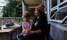  ?? ?? Grace Garvie sits with her daughter Haley at the Watchman cabin on SG ang Gwaay in the Gwaii Haanas reserve.