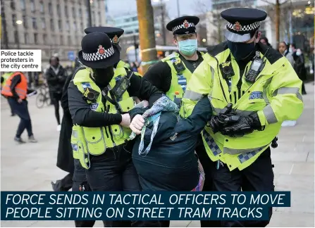  ??  ?? Police tackle protesters in the city centre