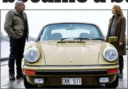  ??  ?? Star car: Saga Noren (Sofia Helin) and Martin Rohde (Kim Bodnia) with her Porsche 911 in The Bridge