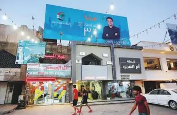  ?? AFP ?? Campaign poster of Ahmad Radhi, former Iraqi footballer, on a street in Baghdad. Radhi says his political group ‘brings together all communitie­s and confession­s.’