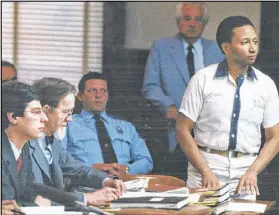  ?? AJC FILE ?? Wayne Williams stands before Superior Court Judge Hal Craig in Butts County Superior Court in 1986. His defense team includes Ron Kuby (from left) and Bobby Lee Cook.