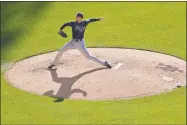  ?? Julie Jacobson / Associated Press ?? Blake Snell delivers against the Mets during the fifth inning on Saturday in New York.