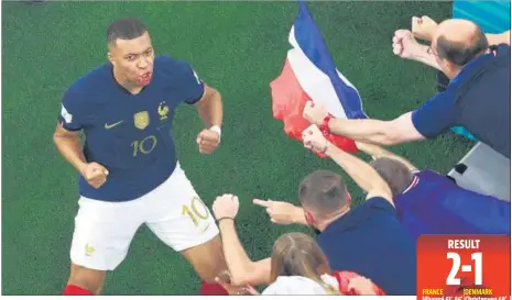  ?? AFP ?? France's Kylian Mbappe celebrates after his second goal against Denmark in their Group D match at Stadium 974 in Doha on Saturday.