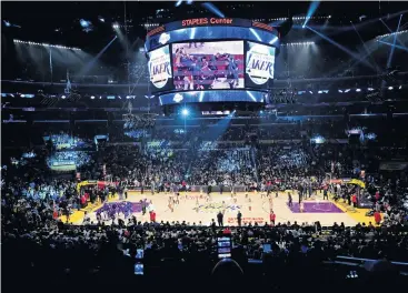  ??  ?? Show time . . . The Staples Center in full buzz before the Los Angeles Lakers take the court.