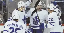  ?? AP PHOTO ?? LEAF SEASON: Nazem Kadri (second from right) celebrates his goal with James van Riemsdyk (25), Morgan Rielly and Tyler Bozak (42) during Toronto’s 7-2 rout of host Winnipeg last night.