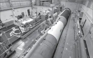  ??  ?? MUMBAI
Airmen ready a Minuteman III ICBM at Vandenberg Air Force Base for test firing.
-AP