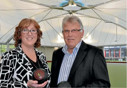  ?? PHOTO: MATTHEW TSO/STUFF ?? Community Facilities Trust chair Kirsten Patterson and Naenae Bowls Club president Ross Thorn under the roof of the covered green at the new Regional Bowls Centre.