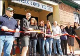  ??  ?? Mad Dogs Hot Dogs in Kutztown, with Northeast Berks Chamber of Commerce members, celebrated their grand opening with a ribbon-cutting on Feb. 18.