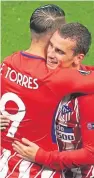  ??  ?? Antoine Griezmann, top, celebrates scoring his side’s second goal and with veteran Fernando Torres after the full-time whistle.