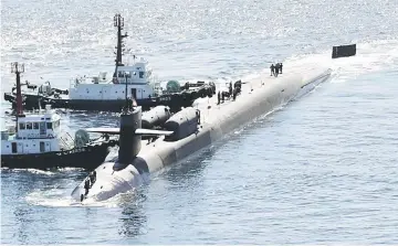  ??  ?? The USS Michigan, a nuclear-powered US Navy submarine, arrives in the port of Busan. — AFP photo