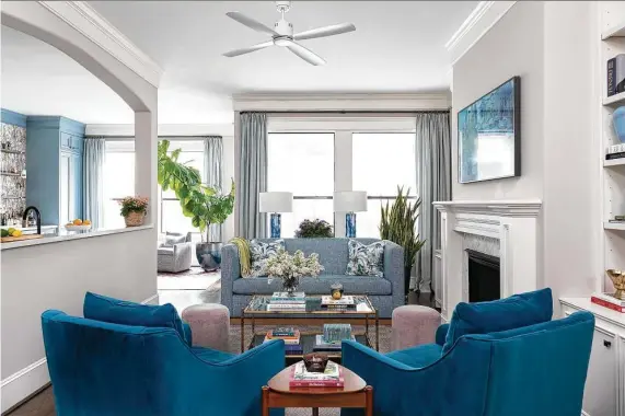  ?? Photos by Michael Hunter ?? A pair of teal chairs and a new sofa make Nick and Claire Petree’s living room cozy.