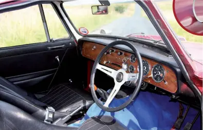  ??  ?? The interior was clearly Herald based, but better specified with gauges taken from the Spitfire plus stylish Microcell Contour 6 bucket seats. The cars originally even had a woodrim Les Leston wheel.