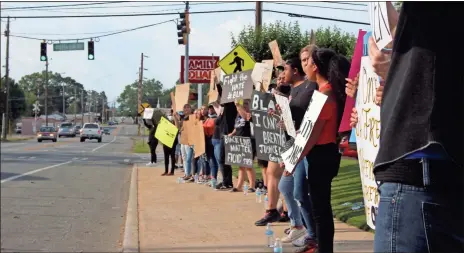  ?? kevin Myrick ?? Several dozen people lined the sidewalk in Rockmart calling for justice for George Floyd and other men and women like him who have been killed by law enforcemen­t.