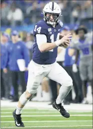  ?? ROGER STEINMAN — THE ASSOCIATED PRESS FILE ?? Penn State quarterbac­k Sean Clifford (14) runs with the ball during the Cotton Bowl against Memphis in Arlington, Texas, Dec. 28, 2019.